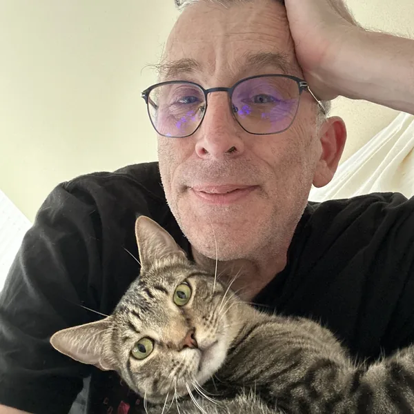 Craig, founder of Simon Says Systems, with his cat